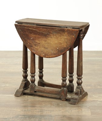 Lot 861 - A CHARLES II STYLE MINIATURE OAK DROP LEAF GATE LEG TABLE