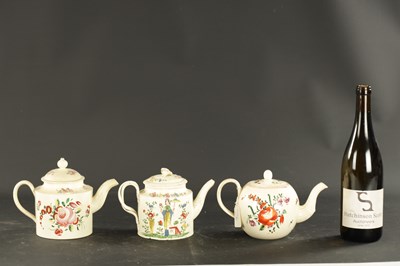 Lot 88 - THREE LATE 18TH CENTURY LEEDS CREAMWARE TEAPOTS WITH POLYCHROME DECORATION