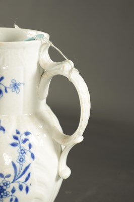 Lot 145 - A LATE 18TH CENTURY CAUGHLEY PORCELAIN JUG PAINTED WITH FLOWERING PLANTS