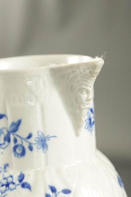 Lot 145 - A LATE 18TH CENTURY CAUGHLEY PORCELAIN JUG PAINTED WITH FLOWERING PLANTS