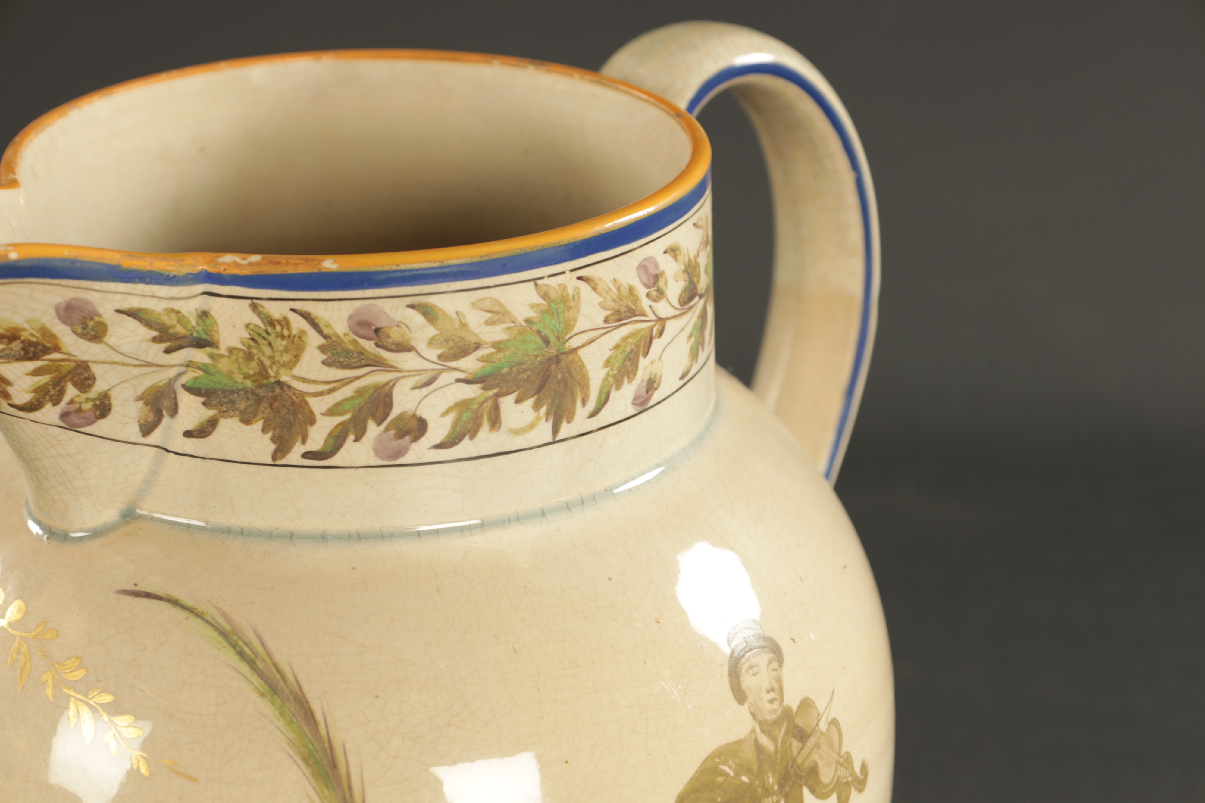 Lot 256 A RARE PEARLWARE JUG PAINTED WITH A MUSICIAN