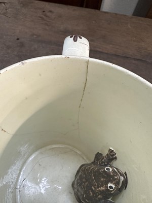 Lot 356 - TWO LATE 18TH CENTURY YORKSHIRE CREAMWARE FROG MUGS