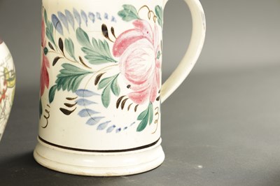 Lot 215 - THREE EARLY 19TH CENTURY ENGLISH POTTERY JUGS AND A MUG