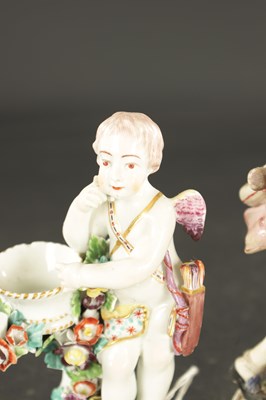 Lot 57 - A PAIR OF MID 18TH CENTURY DERBY CUPIDS WITH BASKETS