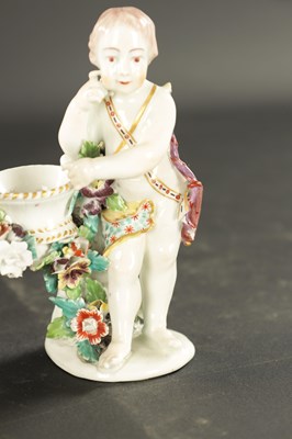 Lot 57 - A PAIR OF MID 18TH CENTURY DERBY CUPIDS WITH BASKETS