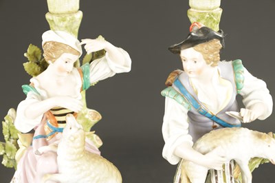 Lot 242 - A PAIR OF DRESDEN CANDLESTICKS OF A SHEPHERD AND SHEPHERDESS