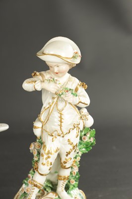 Lot 164 - THREE MID 18TH CENTURY DERBY/CHELSEA PORCELAIN FIGURE GROUPS