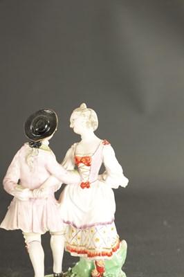 Lot A LATE 18TH CENTURY PAIR OF CHELSEA DERBY PORCELAIN FIGURES CARRYING BASKETS