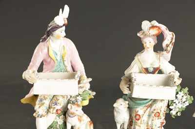 Lot A LATE 18TH CENTURY PAIR OF CHELSEA DERBY PORCELAIN FIGURES CARRYING BASKETS