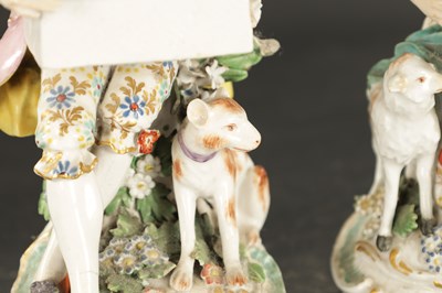 Lot A LATE 18TH CENTURY PAIR OF CHELSEA DERBY PORCELAIN FIGURES CARRYING BASKETS