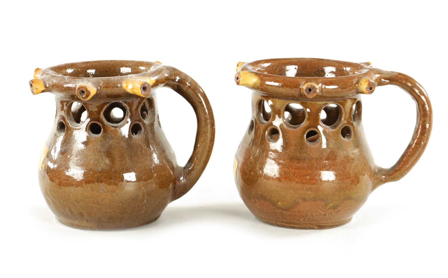 Lot 81 - TWO SLIPWARE PUZZLE JUGS CIRCA 1880