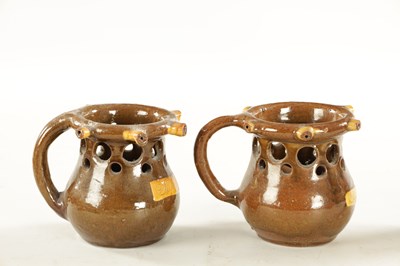 Lot 81 - TWO SLIPWARE PUZZLE JUGS CIRCA 1880