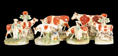 Lot 310 - A COLLECTION OF SEVEN MID 19TH CENTURY STAFFORDSHIRE PORCELAIN FIGURAL COW GROUPS