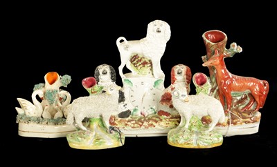 Lot 170 - A STAFFORDSHIRE CLOCK GROUP OF SPANIELS AND POODLE