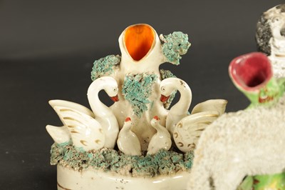 Lot 170 - A STAFFORDSHIRE CLOCK GROUP OF SPANIELS AND POODLE