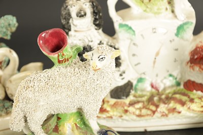 Lot 170 - A STAFFORDSHIRE CLOCK GROUP OF SPANIELS AND POODLE