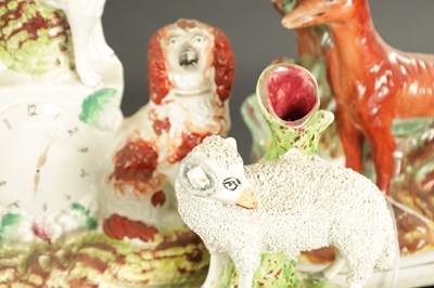 Lot 170 - A STAFFORDSHIRE CLOCK GROUP OF SPANIELS AND POODLE
