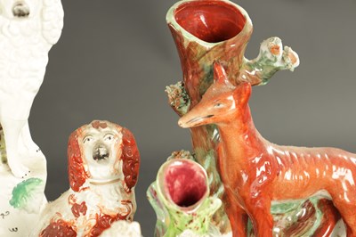 Lot 170 - A STAFFORDSHIRE CLOCK GROUP OF SPANIELS AND POODLE