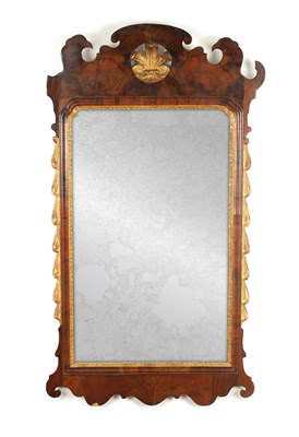 Lot 1225 - AN 18TH CENTURY WALNUT AND PARCEL GILT HANGING MIRROR