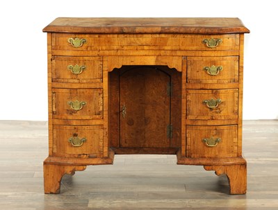 Lot 1340 - AN EARLY 18TH CENTURY CROSS-BANDED FIGURED WALNUT KNEEHOLE DESK