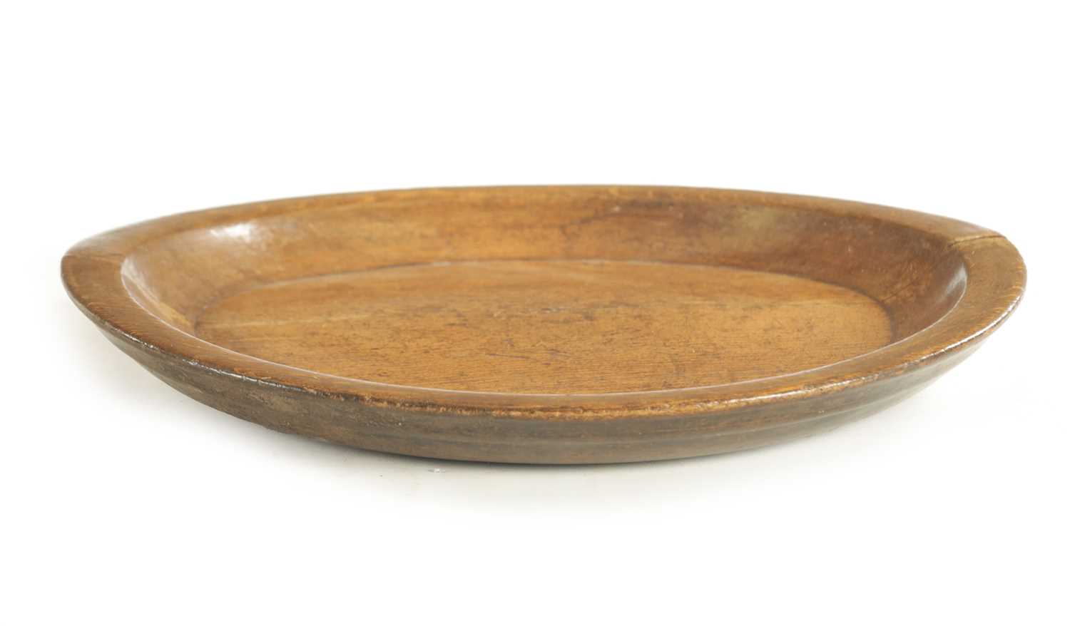 Lot 1159 - A 19TH CENTURY LARGE TURNED TREENWARE SHALLOW DISH