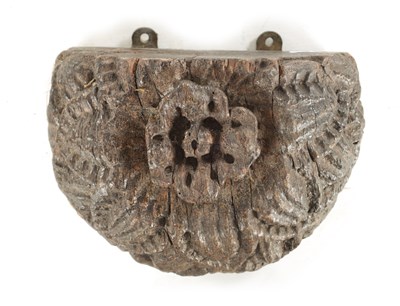 Lot 739 - AN EARLY CARVED OAK WALL BRACKET WITH TUDOR ROSE DECORATION