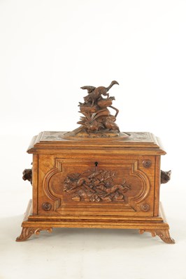 Lot 1168 - A LATE 19TH CENTURY CARVED BLACK FOREST CASKET