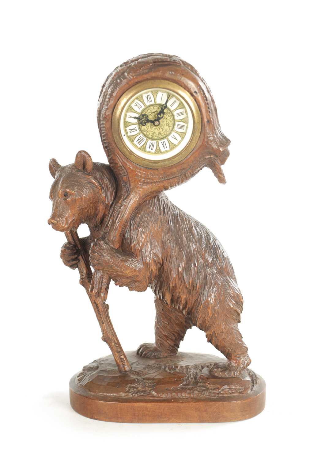 Lot 1202 - AN EARLY 20TH CENTURY BLACK FOREST CARVED BEAR CLOCK