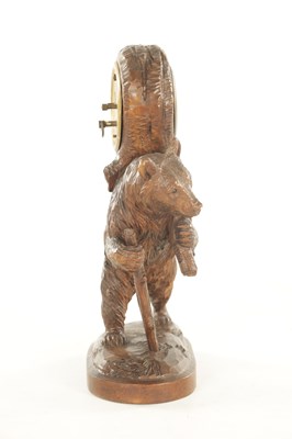 Lot 1202 - AN EARLY 20TH CENTURY BLACK FOREST CARVED BEAR CLOCK