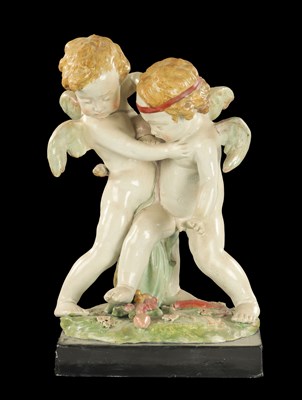 Lot 244 - A LARGE EARLY 19TH CENTURY STAFFORDSHIRE GROUP QUARRELLING CUPIDS