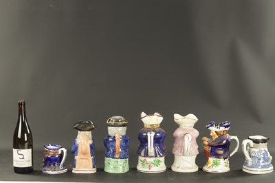 Lot A COLLECTION OF SEVEN LATE 19TH CENTURY STAFFORDSHIRE POTTERY JUGS