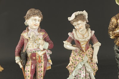 Lot A PAIR OF LATE 19TH CENTURY ROYAL DUX FIGURES OF BOYS