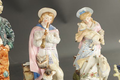 Lot A PAIR OF LATE 19TH CENTURY ROYAL DUX FIGURES OF BOYS