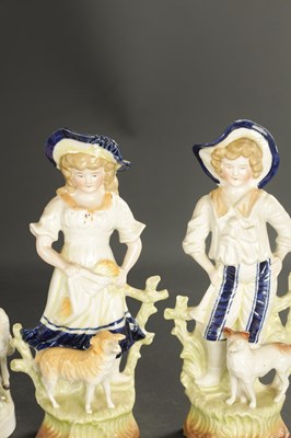 Lot A PAIR OF LATE 19TH CENTURY ROYAL DUX FIGURES OF BOYS