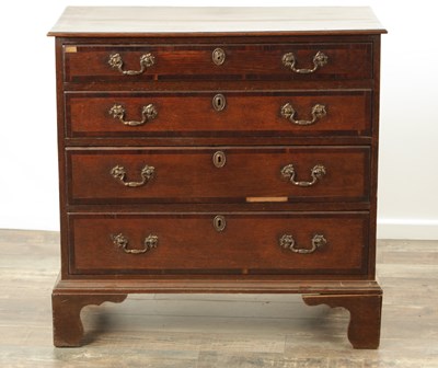 Lot 857 - A GEORGE III OAK AND WALNUT CROSS-BANDED CHEST OF DRAWERS