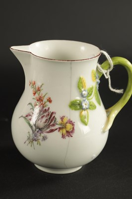 Lot 400 - A RARE CHELSEA PORCELAIN SPARROW BEAK CREAM JUG CIRCA 1755, together with A CHELSEA PORCELAIN PLATE PAINTED WITH EXOTIC BIRDS CIRCA 1760