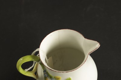 Lot 400 - A RARE CHELSEA PORCELAIN SPARROW BEAK CREAM JUG CIRCA 1755, together with A CHELSEA PORCELAIN PLATE PAINTED WITH EXOTIC BIRDS CIRCA 1760