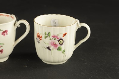 Lot 38 - A WORCESTER FLUTED COFFEE CUP AND SAUCER PAINTED WITH FLOWERS WITH TWO OTHERS, ONE WITH CHINESE FIGURES CIRCA 1770