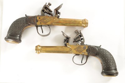 Lot 519 - BOUTET A VERSAILLES. A PAIR OF EARLY 19TH CENTURY FRENCH BRASS FLINTLOCK PISTOLS