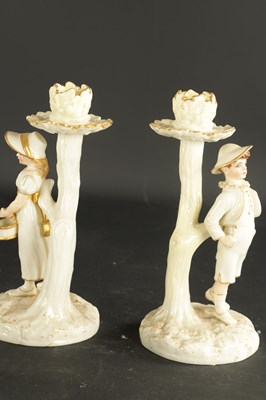 Lot 248 - A PAIR OF ROYAL WORCESTER CANDLESTICKS