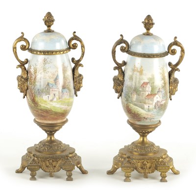 Lot 696 - A PAIR OF LATE 19TH CENTURY PORCELAIN AND ORMOLU MOUNTED URNS