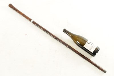 Lot 473 - A LATE 19TH CENTURY BAMBOO 'FLICK STICK' WALKING CANE