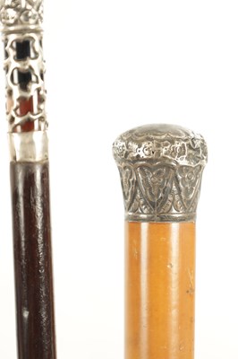 Lot A COLLECTION OF THREE EARLY 20TH CENTURY SILVER MOUNTED WALKING STICKS