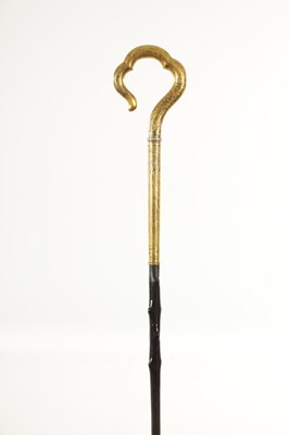 Lot 471 - A LATE 19TH CENTURY ORIENTAL GILT MIXED METAL WALKING STICK