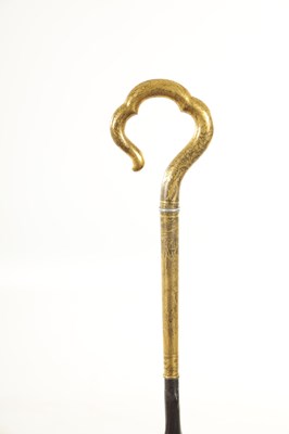 Lot 471 - A LATE 19TH CENTURY ORIENTAL GILT MIXED METAL WALKING STICK