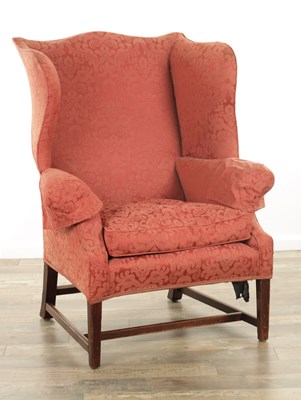 Lot 1395 - A GEORGE III MAHOGANY WING BACK UPHOLSTERED ARMCHAIR