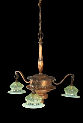 Lot 670 - AN EARLY 20TH CENTURY COPPER THREE BRANCH CHANDELIER WITH VASALINE SHADES