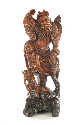 Lot 119 - A 19TH CENTURY CHINESE CARVED BOXWOOD STATUE OF A BEARDED IMMORTAL