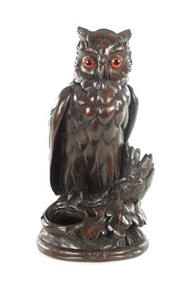 Lot 1153 - A 19TH CENTURY CARVED WALNUT TOBACCO JAR FORMED AS AN OWL