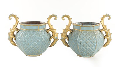 Lot 810 - A STYLISH PAIR OF EARLY 20TH CENTURY ENAMELED CAST IRON JARDINIERES BY FAURE REVIN